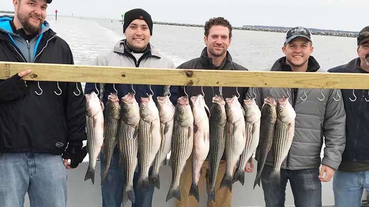 ryan fishing for striped bass in maryland