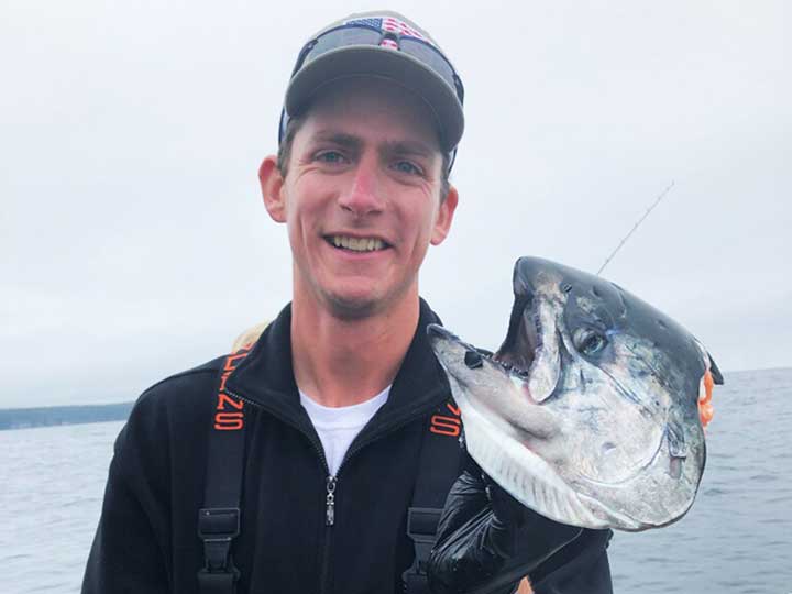 holding a king salmon head the salmon got taken by a seal lion while fishing