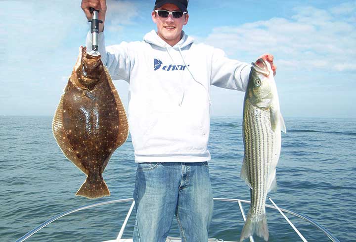 captain cody catches a huge fluke and striped bass in new jersey