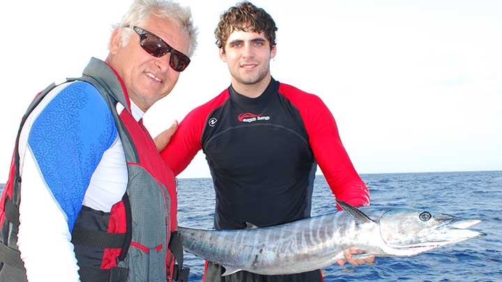 kevin holding a big wahoo caught while trolling
