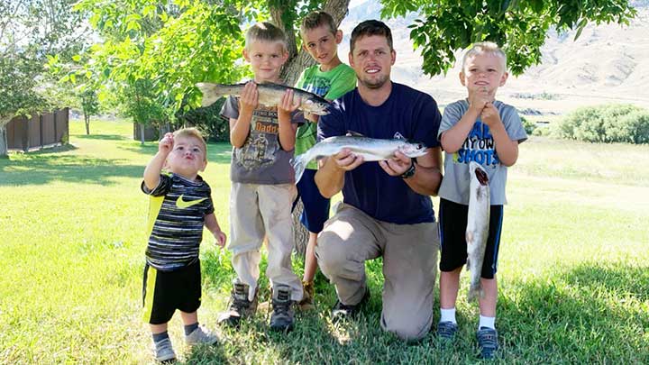 mark and kids with trout caught using the best trout lures