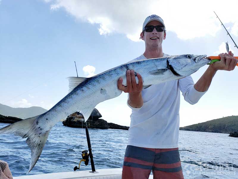 Captain Cody holding a great barracuda