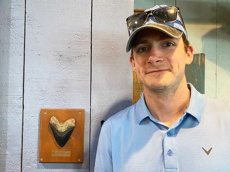 Captain Cody with a megalodon shark tooth