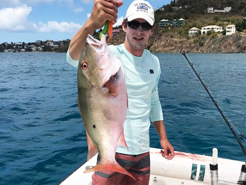 captain cody holding a mutton snapper