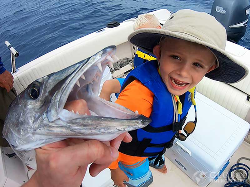 kid scared from sharp barracuda teeth