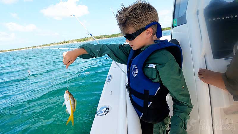 my nephew catching a small yellowtail snapper